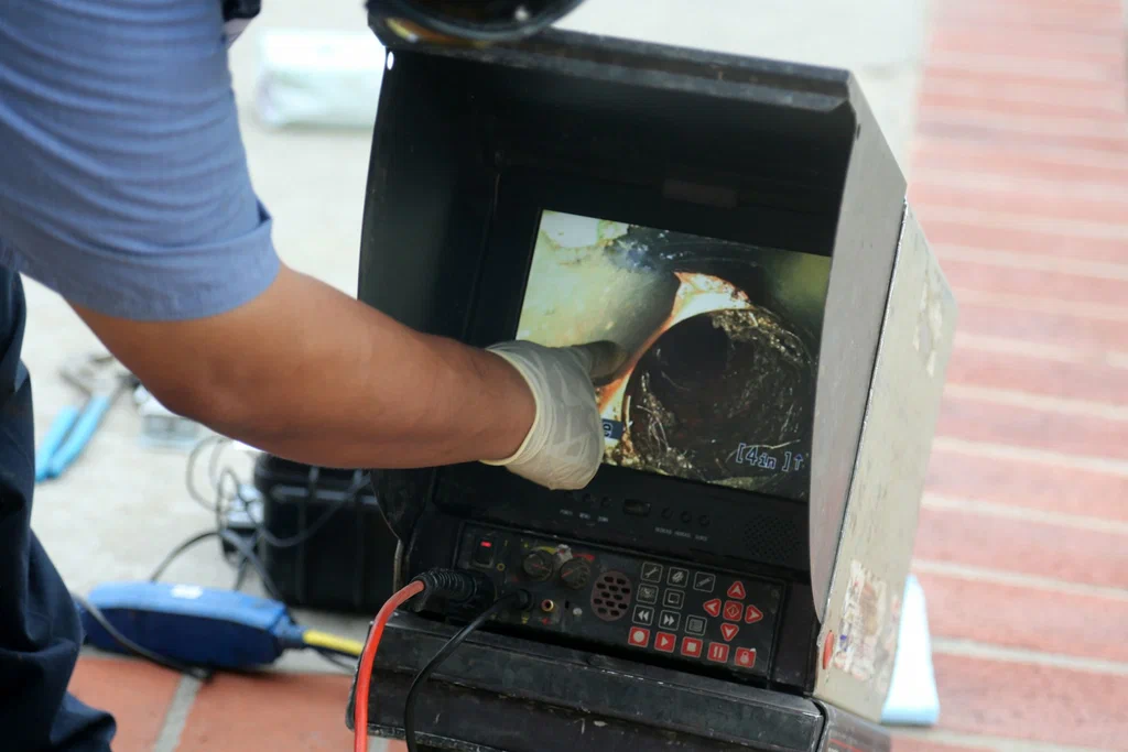 Technician viewing a drain inspection camera in Battleground